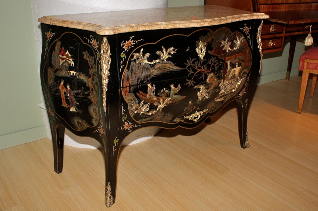 French Louis XV style chinoiserie commode with black-lacquer ground, gilt-bronze mounts, marble top, and working lock and key.  The chinese images are colorful and very well executed.