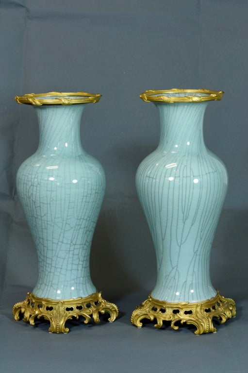 A large nicely-cast gilt-bronze mounted Chinese celadon vases in the Louis XV style, with faux crackle patterning and gilt-bronze rims.  Unknown mark on the bottom of the vases.