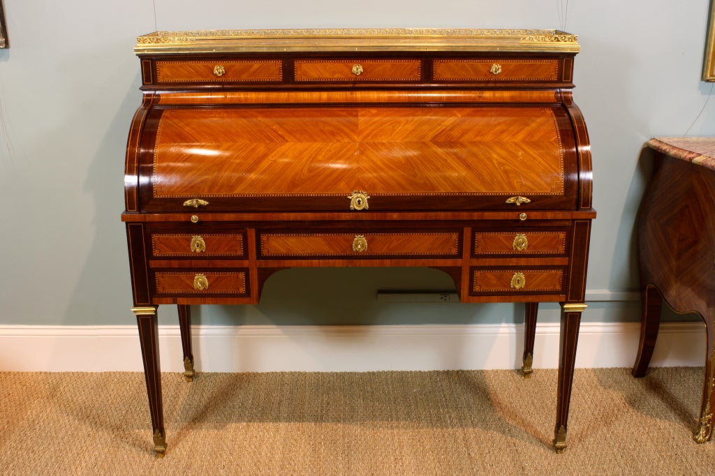 A high-quality Louis XVI style cylinder desk (or 