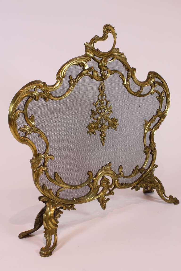 A lovely French gilt-bronze firescreen in the Louis XV style (Circa 1880), featuring nicely-cast stylized cornucopia and acanthus leaves.  Original gilded surfaces.