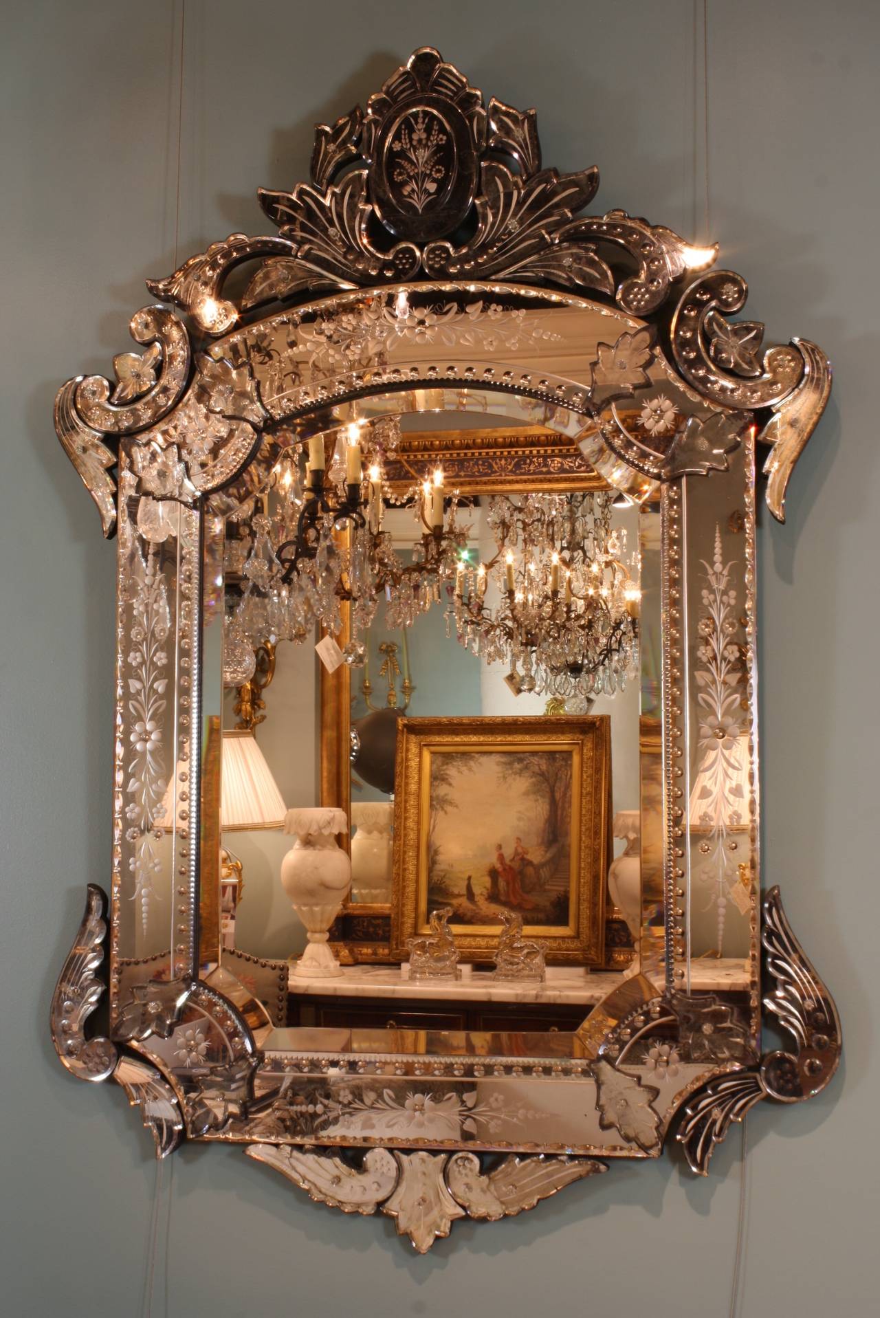 A beautifully-detailed Venetian mirror in the Rococo style with bevelled glass, detailed cartouche, 