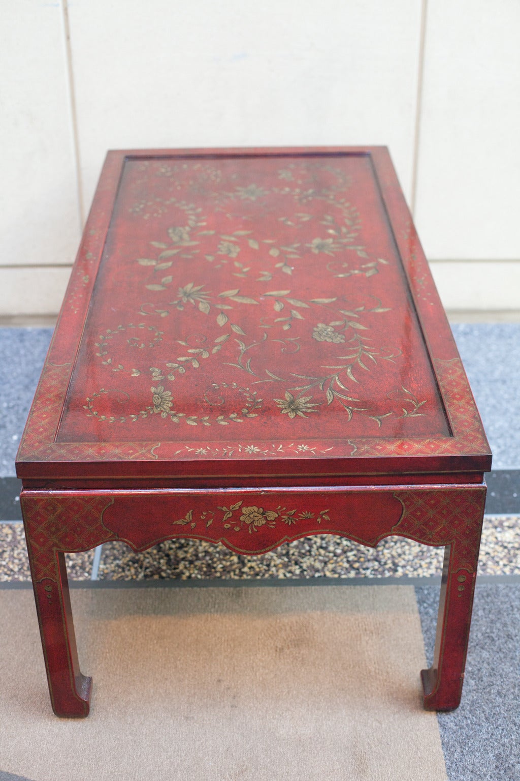 American Hand Decorated Coffee Table in Dark Red with a Gilt Floral Chinoiserie Design