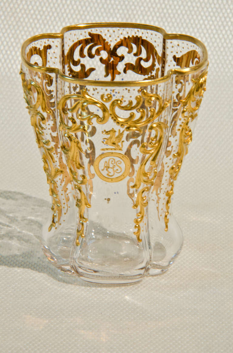 Set of 11 perfectly rare Moser glasses with a quatrefoil shape.  Hand blown with heavily applied gold decoration, each has a crest and monogram.