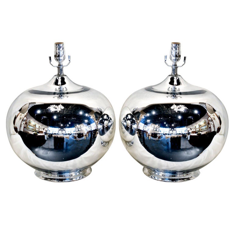 Pair of large rounded gazing ball form mercury glass lamps.  The paper shades have a soft platinum grey metallic finish with chrome ball finials.