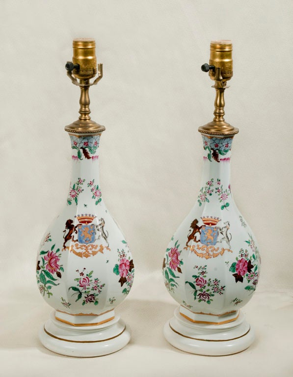 Pair of Samson porcelain armorial hand-painted vases mounted as lamps on white painted wooden bases. Pair of bell shaped shades included. The shades are 7.5