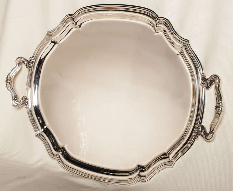 Buccellati sterling tray with two handles and marked on the reverse. The tray is ovoid in shape, however it appears to be round in the photo. Approximately 102 troy ounces.