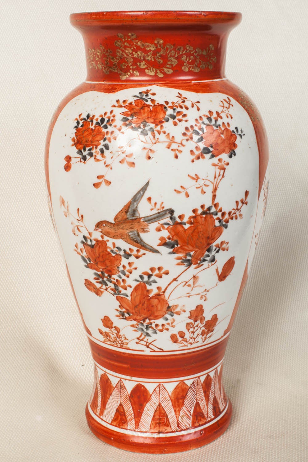 Tall Japanese Ko-Kutani vase from the Meiji period. It is beautifully hand decorated with panels of birds and boys in iron red enamel. Signed on the base.