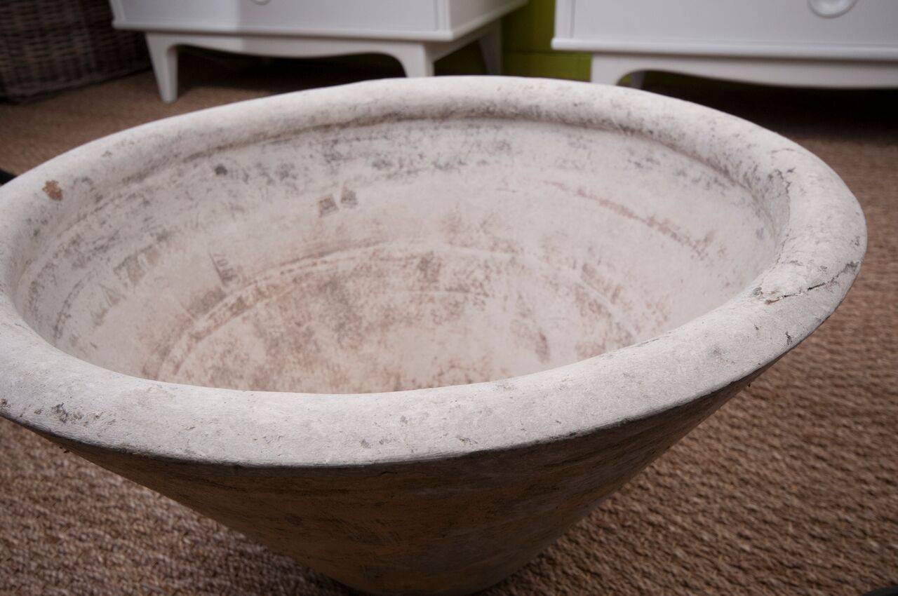 A cement planter designed by Willy Guhl from Switzerland.  The piece has drain holes in the base for use outside, but would look great inside as a large bowl.