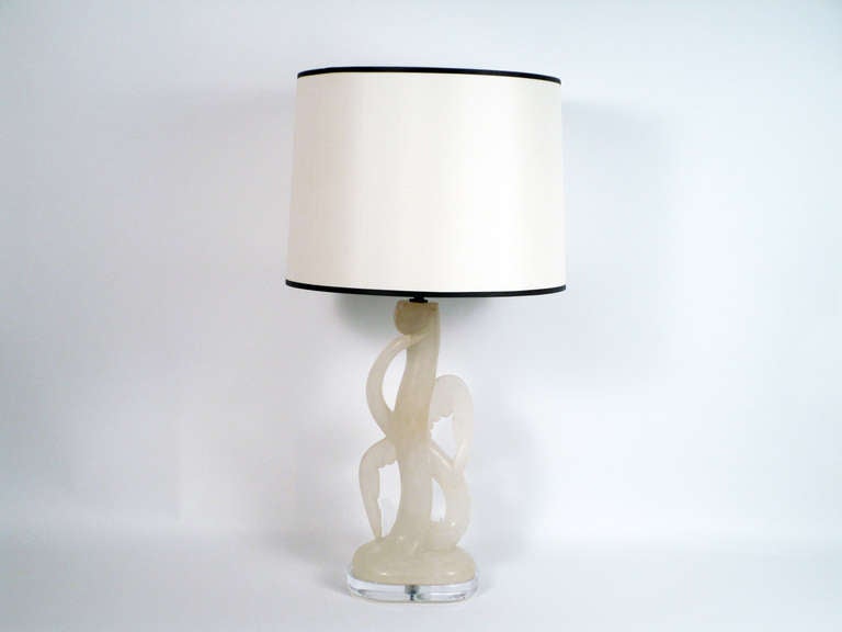 + An elegant lamp that is a unique piece of sculpture
+ Artisan made lamp in the form of an aquatic bird (egret, heron, ibis)
+ Hand carved cream colored Italian alabaster
+ Bird's wings and body wrap around a central curving element
+ Sinuous