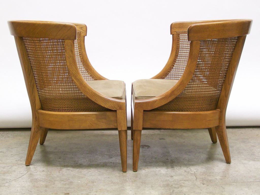 Pair of rounded caned back leather club chairs.

Seat height: 15
