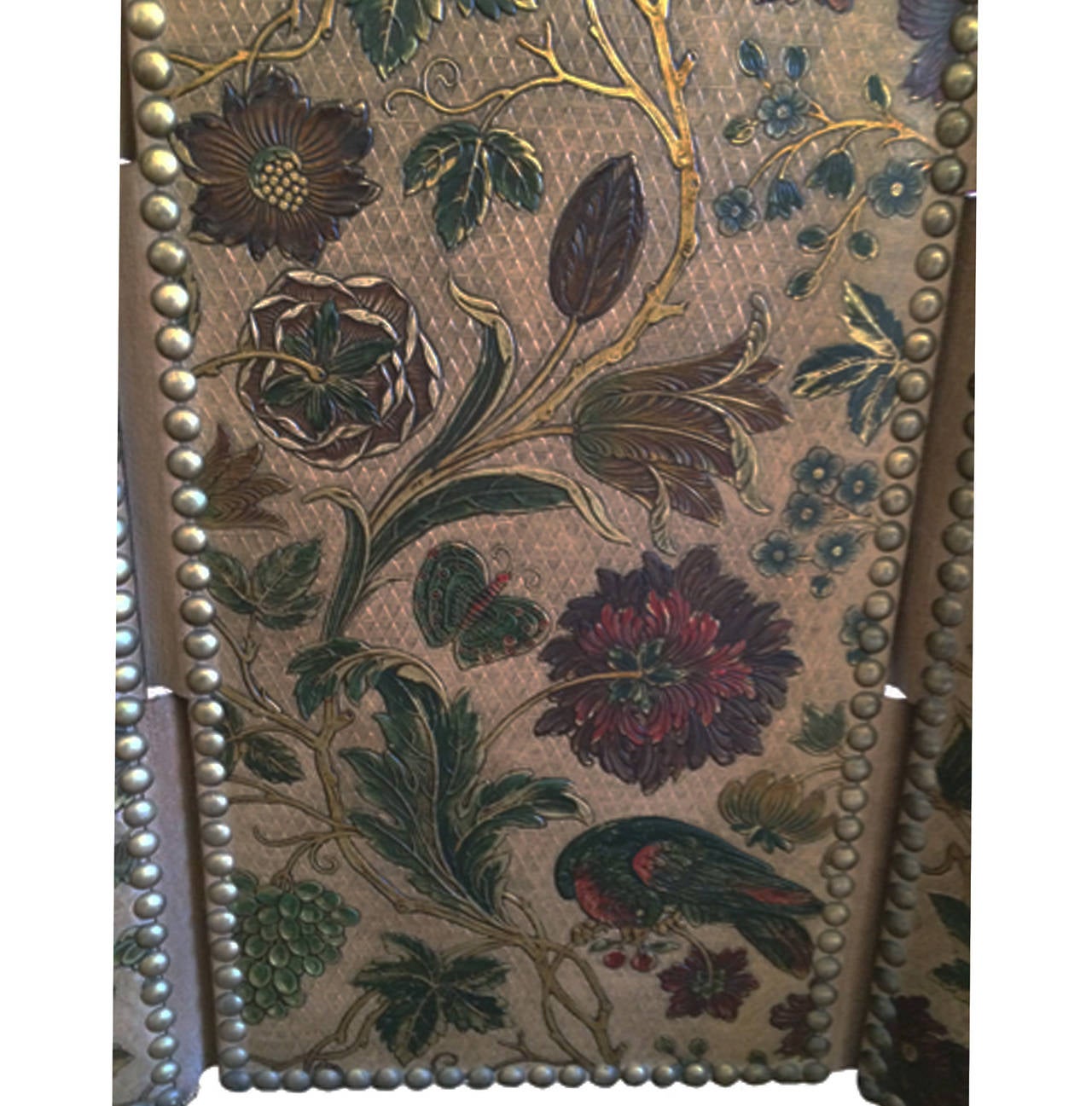 Spanish three-panel leather screen; birds, flowers and a touch of gilt, nailhead borders, circa 1920.