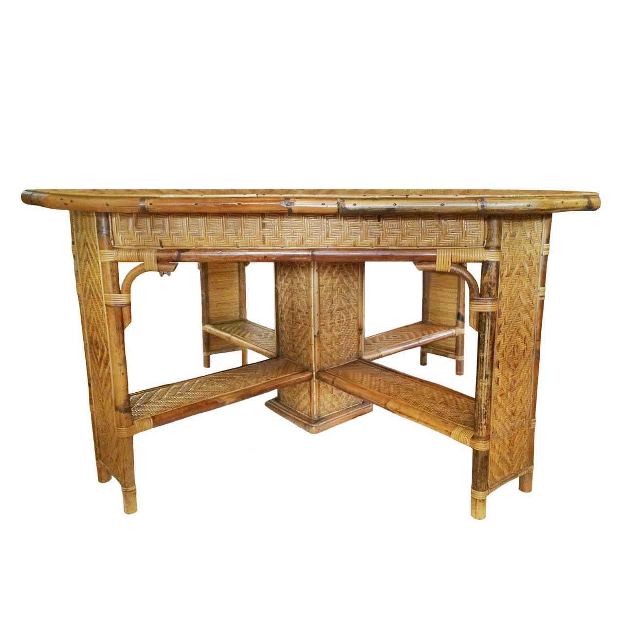 French woven bamboo center table; framed angled center pedestal with four stretchers leading to repeated framed inset woven legs. Intricately patterned diamond weave; excellent condition, circa 1880.