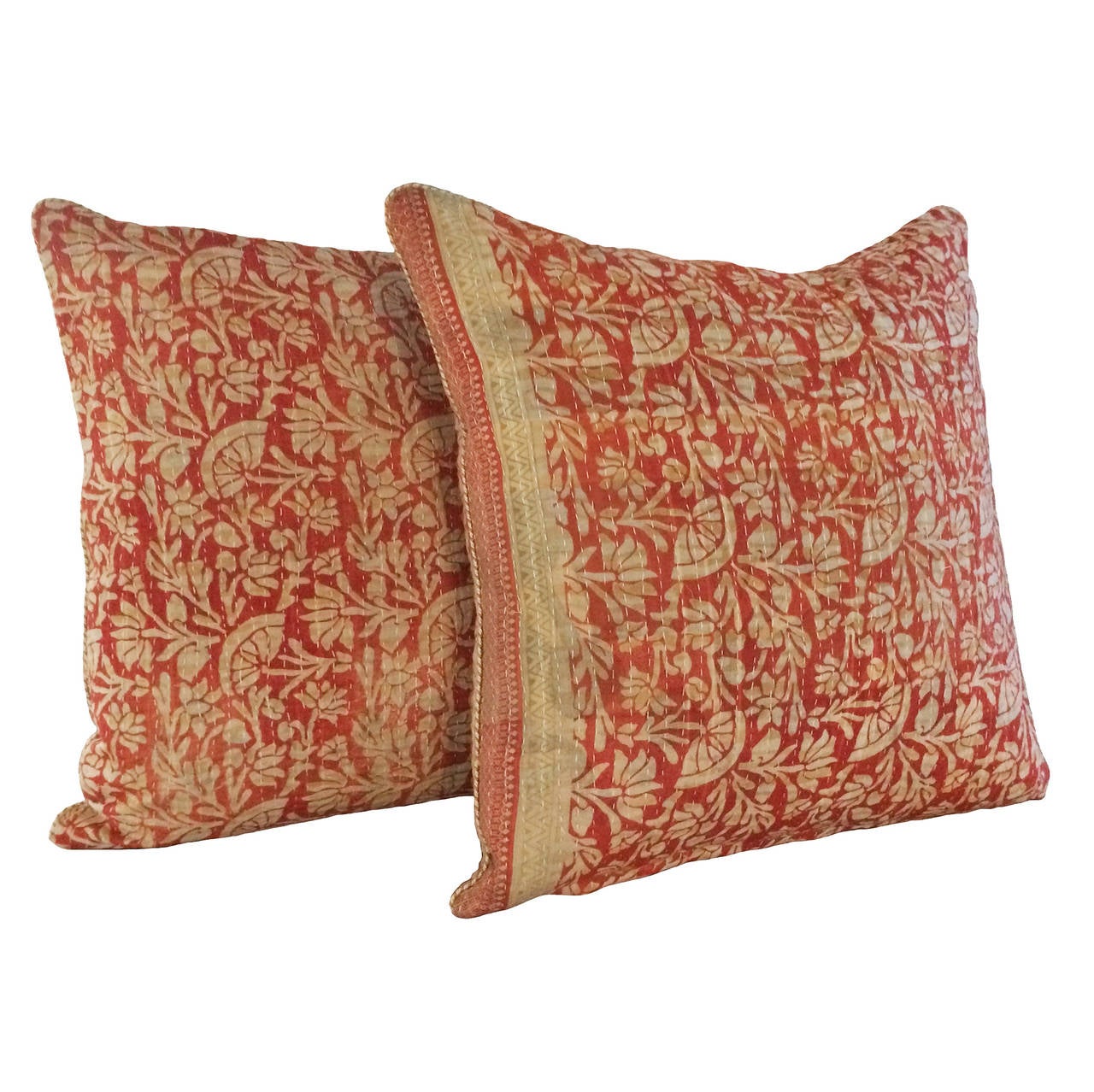 A pair of vintage hand-stitched Kantha down pillows; vintage fabric on both sides; muted terracotta red, beige; India; 19th century.