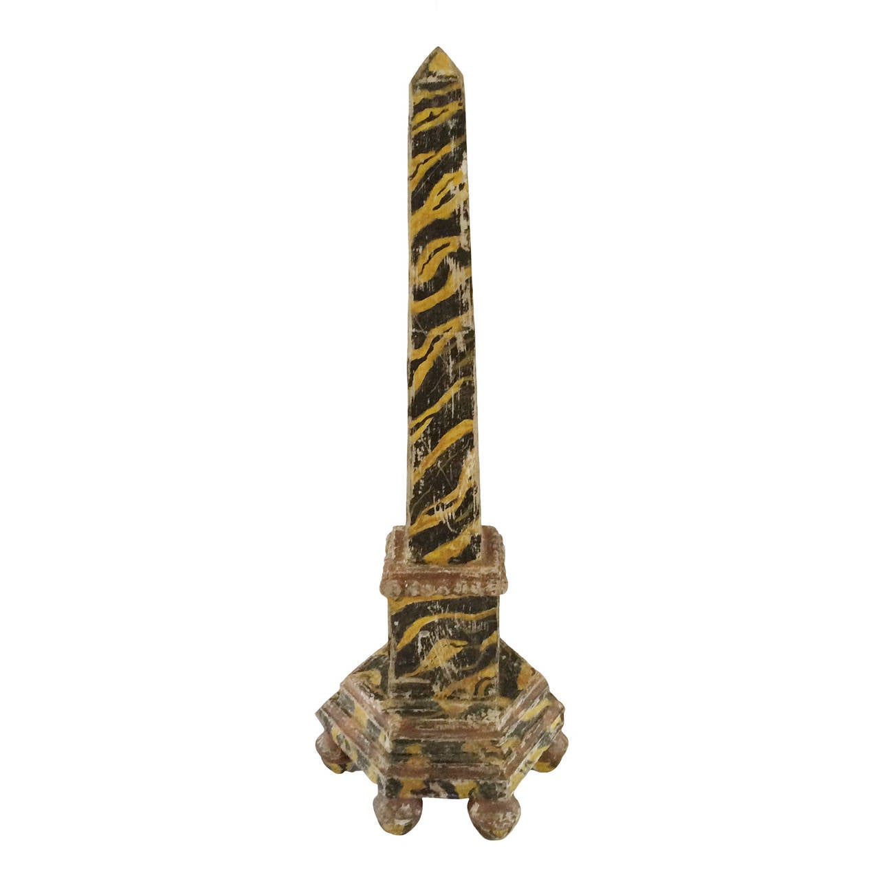 A pair of 19th century, Italian marbleized obelisks; yellow and black; hexagonal base on ball feet.