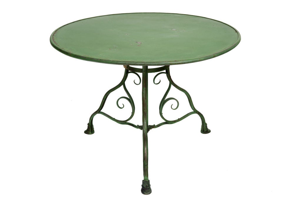 French Fabulous Green Iron Table; curved tripod base leading down to three hooved feet.  Originally designed for the Luxemborg Gardens; 20th Century.  Priced Individually.