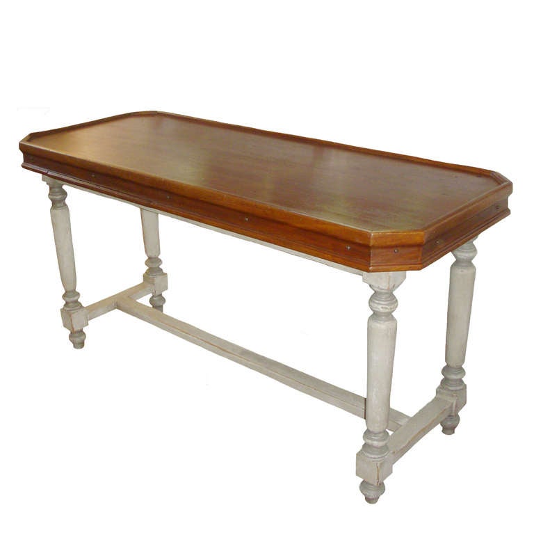 French Polychrome Drapers Table; walnut tray shaped top; rivet details around the apron; two hidden pull out trays; 19th Century.  Multi faceted use as a sofa table, console or serving table.
