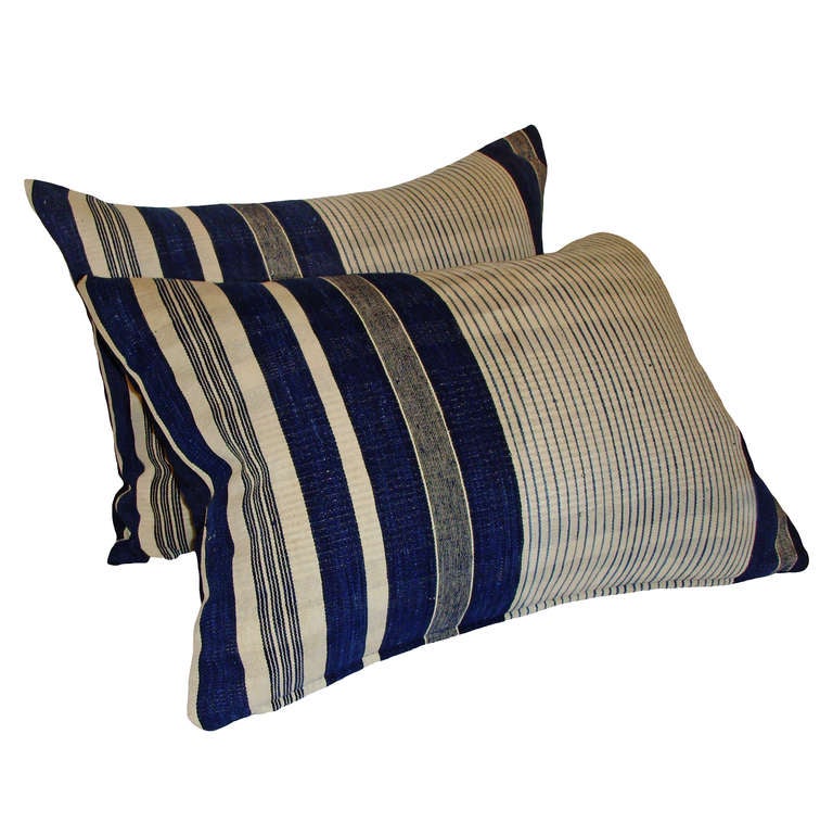 A very unusual pair of African Indigo Hemp striped down pillows with japanese boro backing; 19th Century.