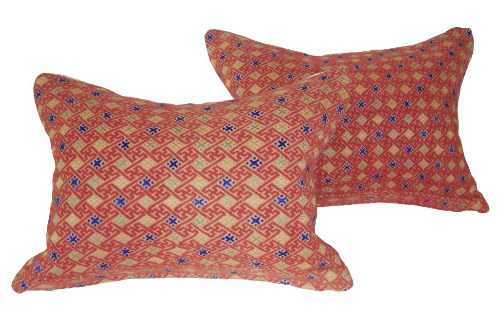 Pair of custom Chinese Red Brocade down Pillows with parchment hemp backing; 19th Century.Beautiful combination of colors:  red, beige, blue.  Sold as a pair.  Priced individually.