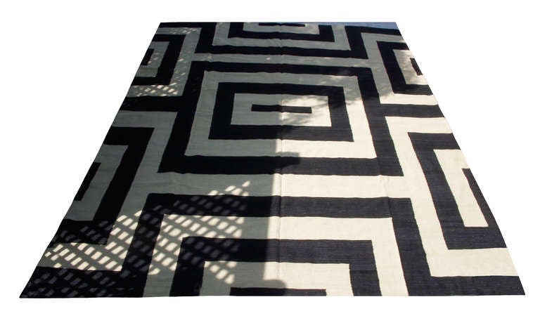 Black and Ivory Geometric Afghan Wool Kilim; a bold monotone labyrinth pattern; 20th Century;  12.75' x 9.5'