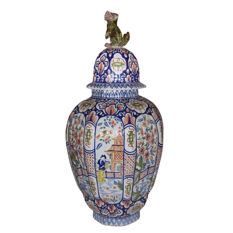 Pair of large tin glazed polychrome ribbed Delft covered vases; Chinoiserie decoration; 19th Century.