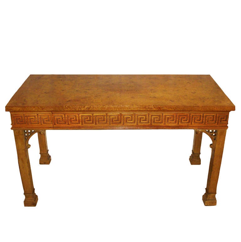 Mid-Century English Chippendale Table with hidden drawer.  Bold geometric Greek Key bordered apron with lattice work arch supports leading down to a series of projected moldings.