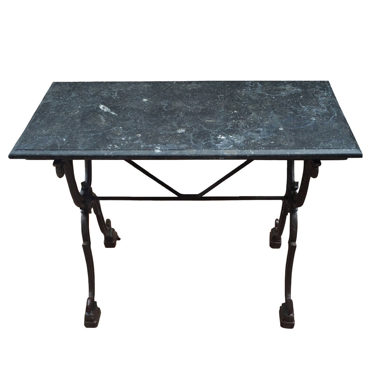 French butcher table with petit granite stone top; intricate iron base, 19th century.