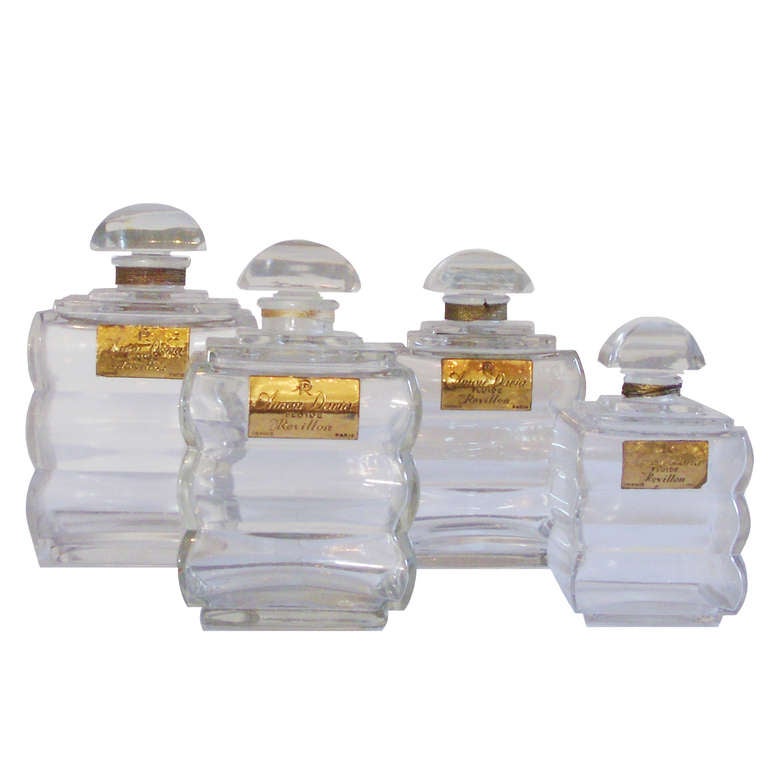 Set of Four fabulous Revillon Parfum Crystal Parfum Bottles with original labels; France;  Circa 1900.  An era of glamor.
Assorted sizes ranging 4.25