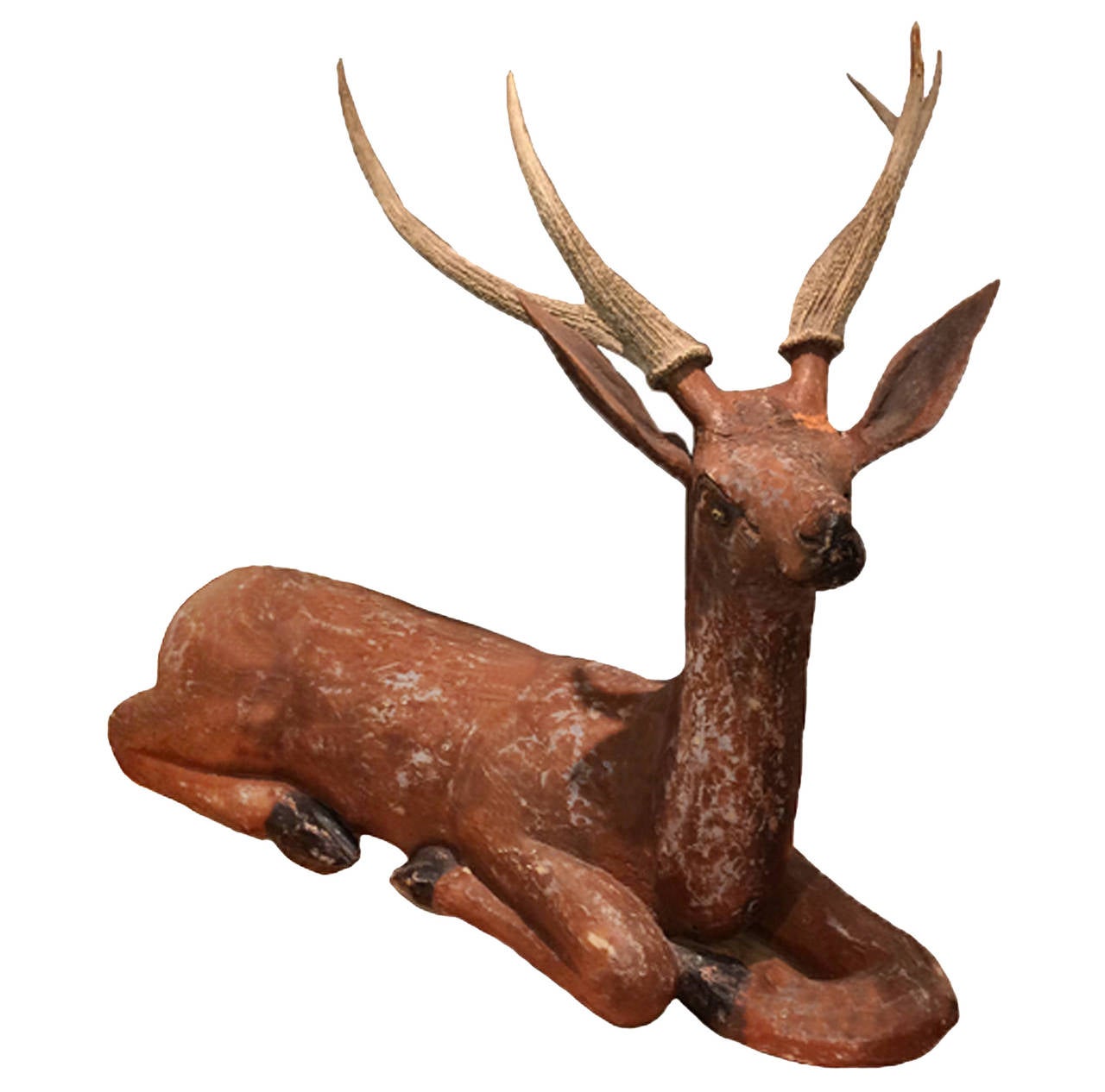 Pair of life-size French reclining deer; original paint; real antlers; circa 1880. Beautiful patina and carving. Such majesty and pure serenity!   Sold as a pair.
45W x 28D x 40H
48W x 28D x 39H