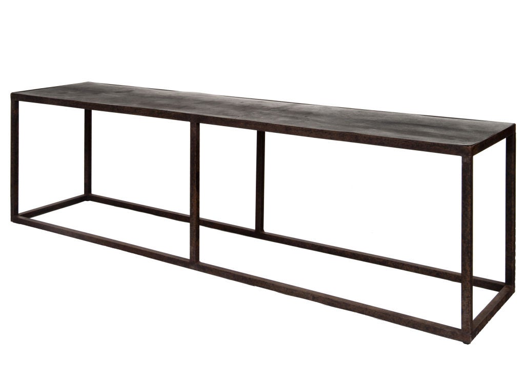 Axel Vervoordt style iron frame table with recycled rubber top; Belgium.  Use a pair side by side for a larger scale coffee table.