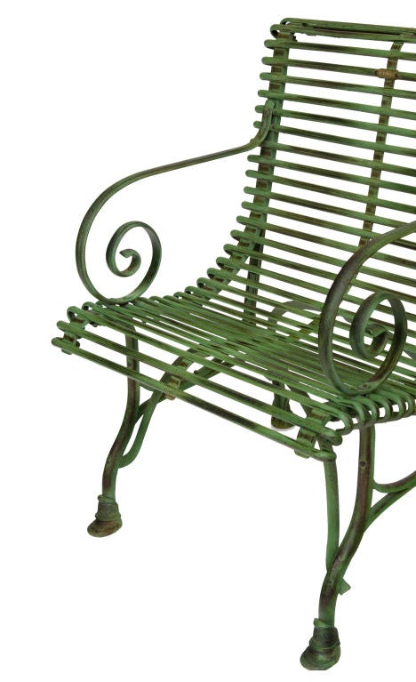 French Green Iron Garden Arm Chair with gracefully curved arms; originally designed for the Luxemborg Gardens; 20th Century.