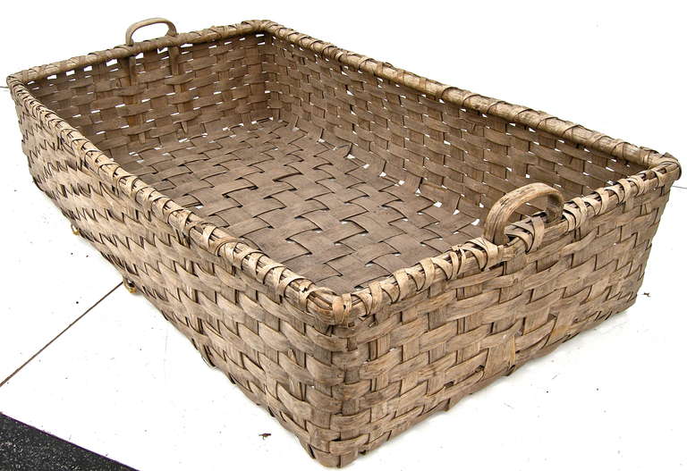 A beautiful, large scale, vintage tobacco-picking basket of Kentucky origins. Handsome woven split-wood construction with a striking time worn and weathered overall surface and patina. Subtle standout.