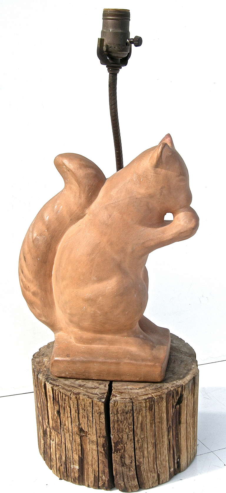 Delightful vintage, Adirondack origins, table light, with a whimsical Mr. Squirrel motif. Of hand made terra cotta, this handsome guy is busy with his favorite nut. Resting on a piece of hand-cut hard wood. Height below to top of socket.