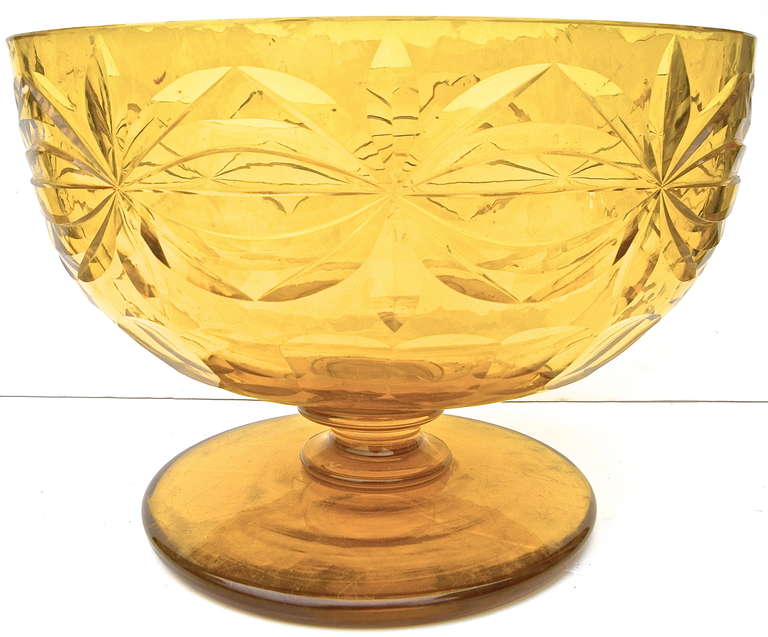 Beautiful antique, American cut-glass compote. Having a vibrant, brilliant amber color with a graceful shape and form.