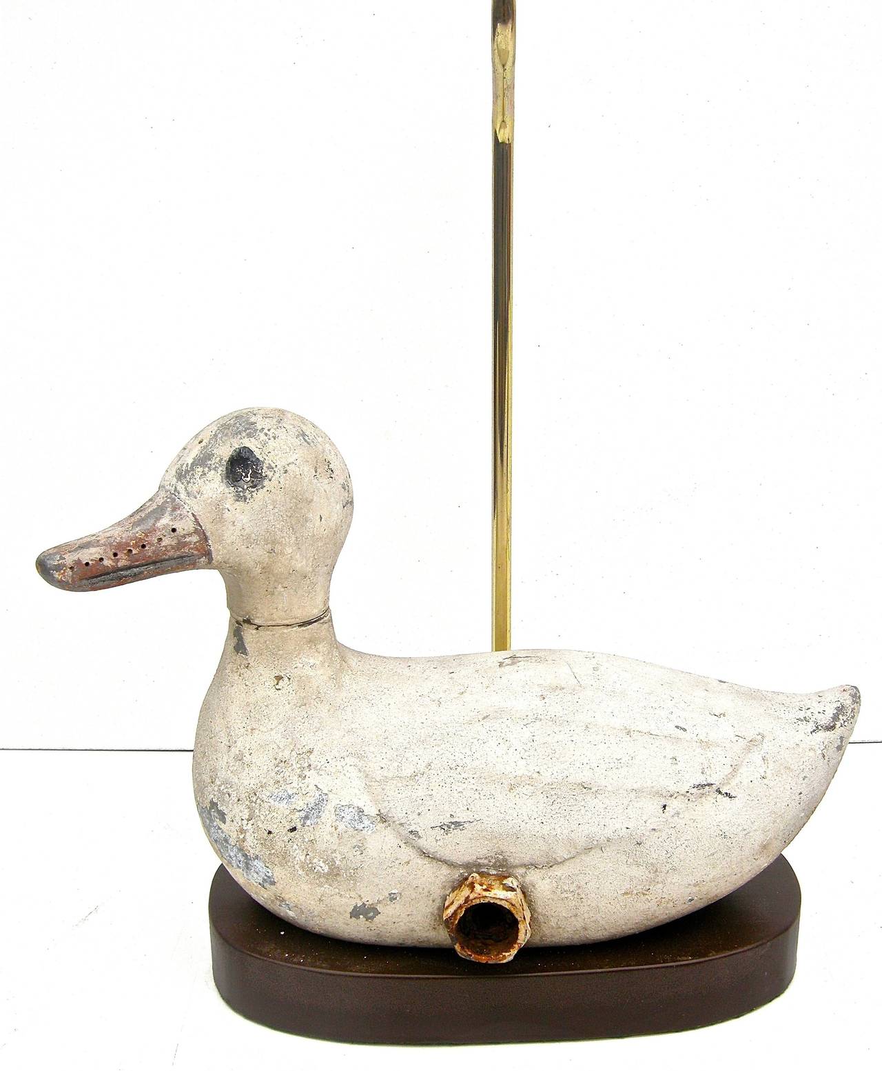 Wonderful, vintage, sprinkler in a charming duck motif. Whimsical revolving head with sprinkler in ducks beak. Time worn and weathered overall surface and aged patina. Vintage hose nob as finial accent. Custom Stand. H below to top of finial. H to