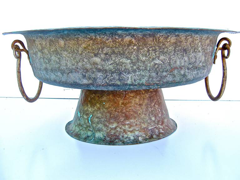 Beautiful vintage copper vessel or urn with aged surface and patina.