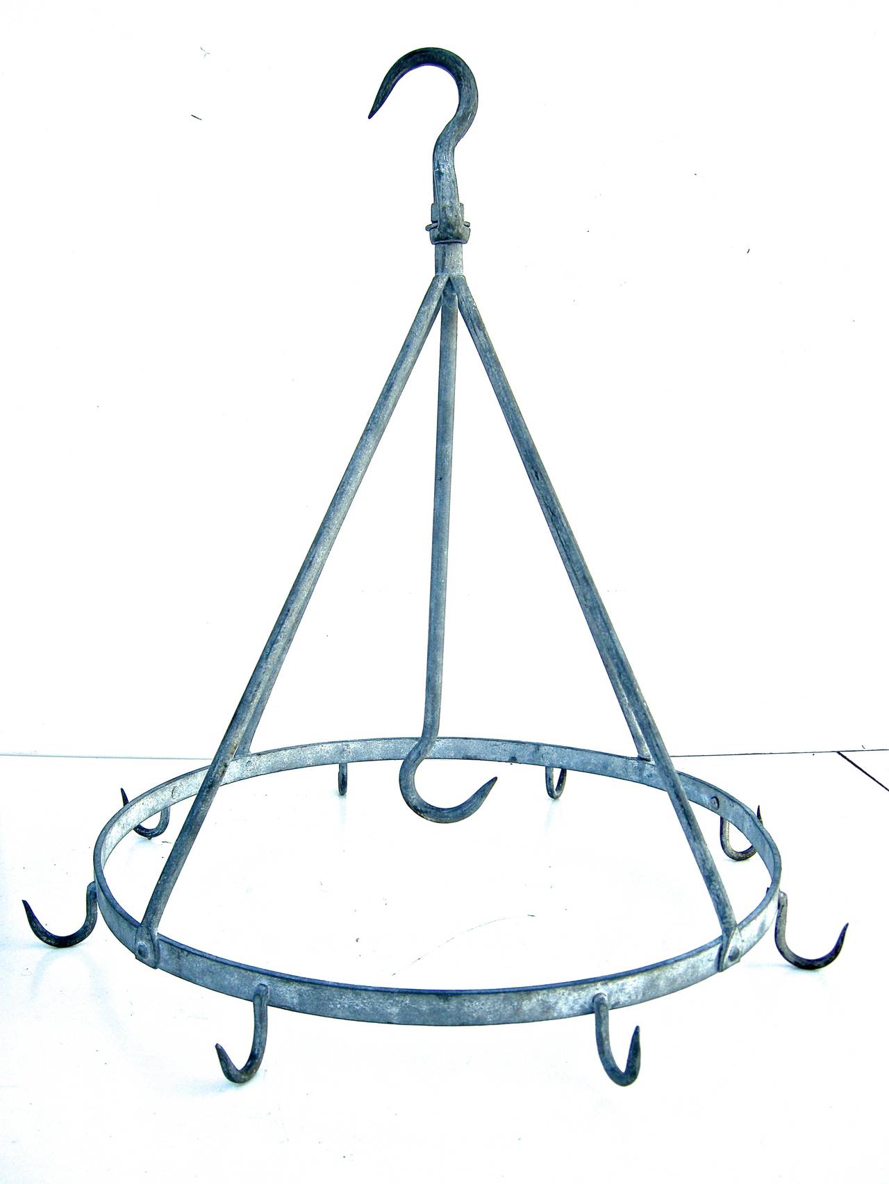 Terrific, vintage, French meat rack in an unusual circular shape and form. Galvanized zinc metal construction with time worn and weathered surface and aged patina.