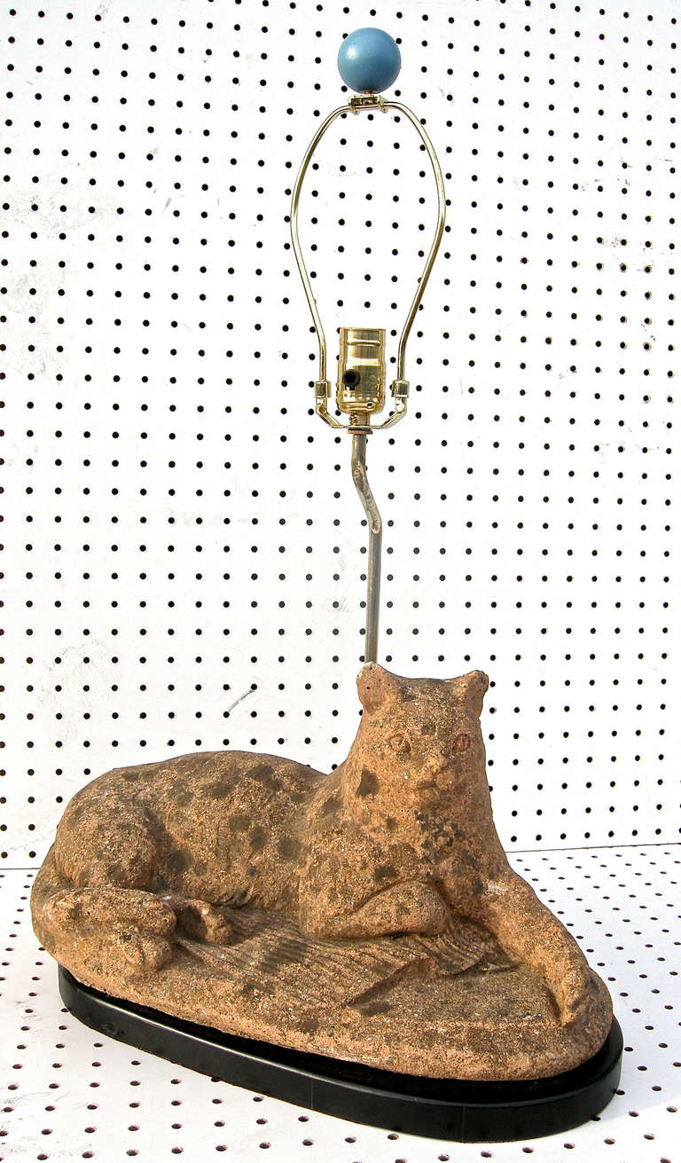 A terrific vintage table lamp with a mischievous cat motif. Crafted from a mid century English, carved red stone, garden cat. It's supposed blue play ball is used as the finial. A felines light delight.Wired/working condition. H to finial: 27