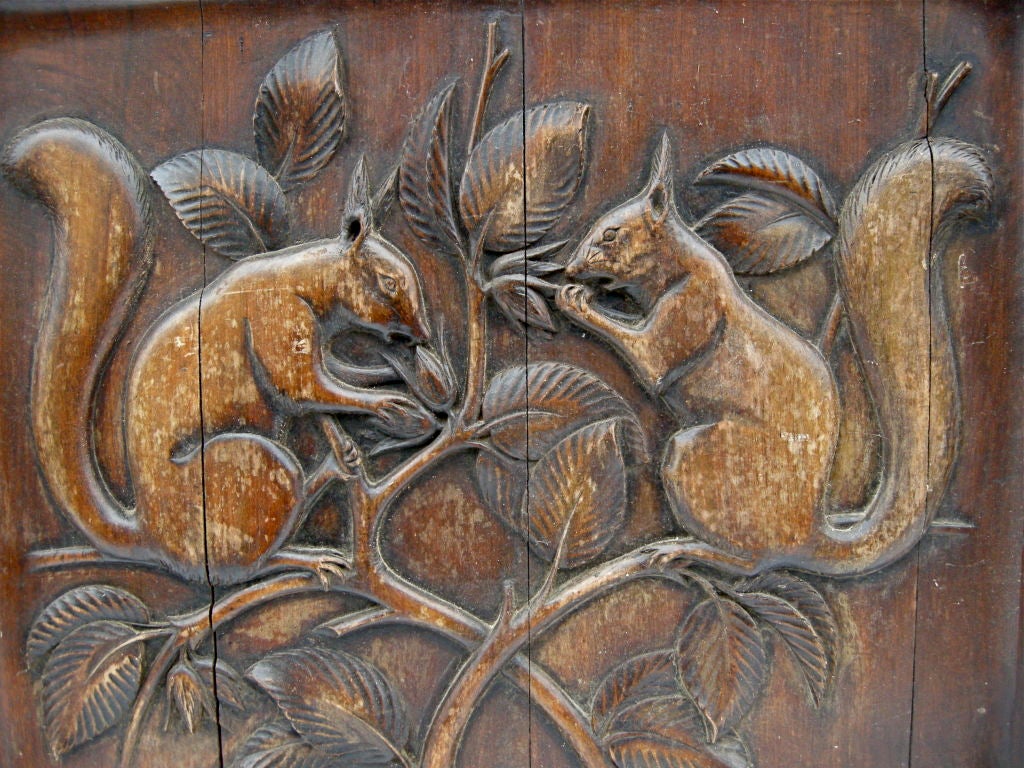 A wonderful hand carved folky, wooden panel having a charming and whimsical motif of two seemingly smitten squirrels. Delicately and deeply carved with strong details.  Originally, possibly had been part of a larger room panelling series. A fun and