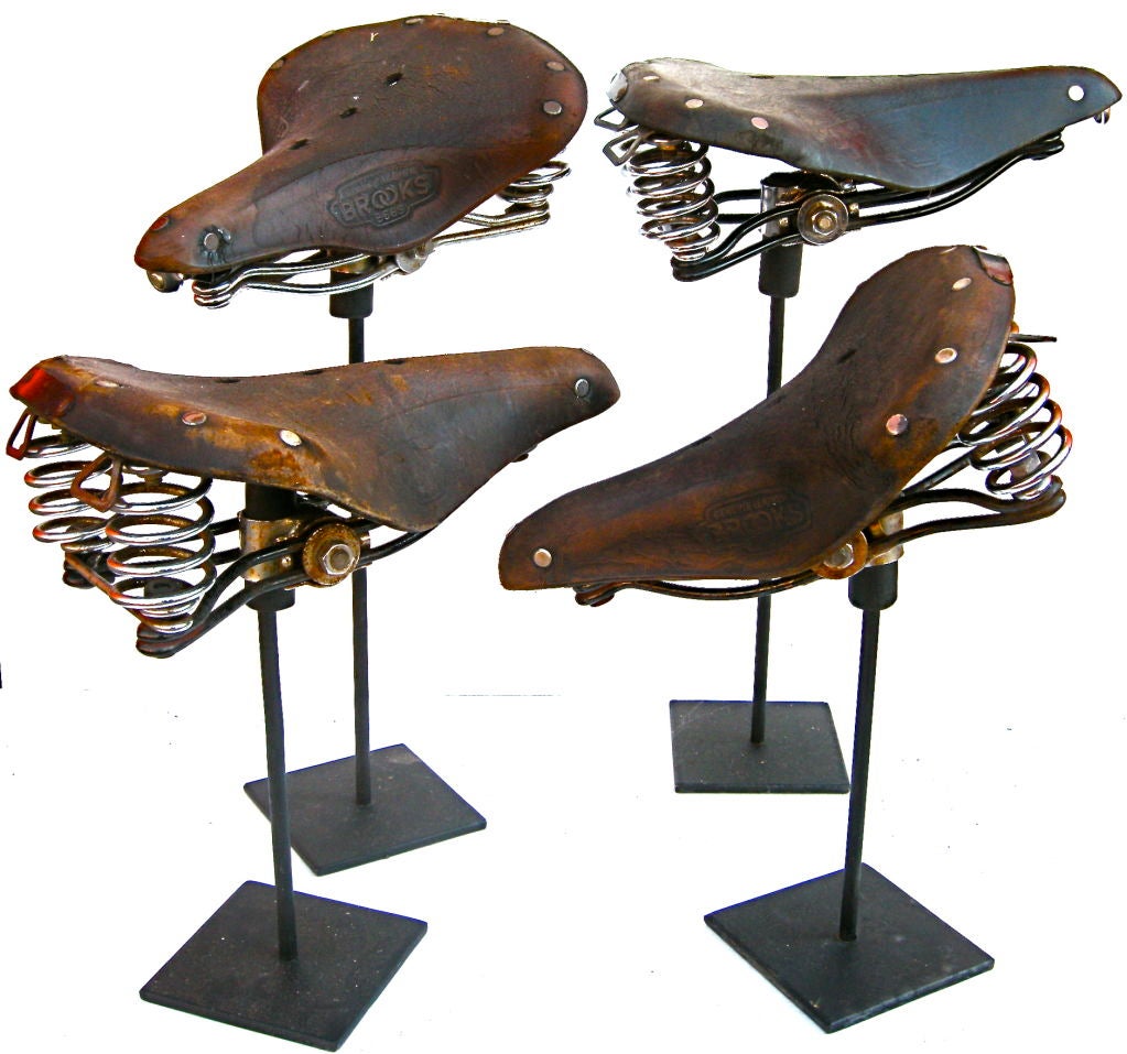 A great set of vintage bicycle seats.  Each exhibiting a whimsical, sculptural and industrial visual aesthetic and appeal. Having warm overall time worn and weathered surfaces and patinas. Perfect for all exercise procrastinators.