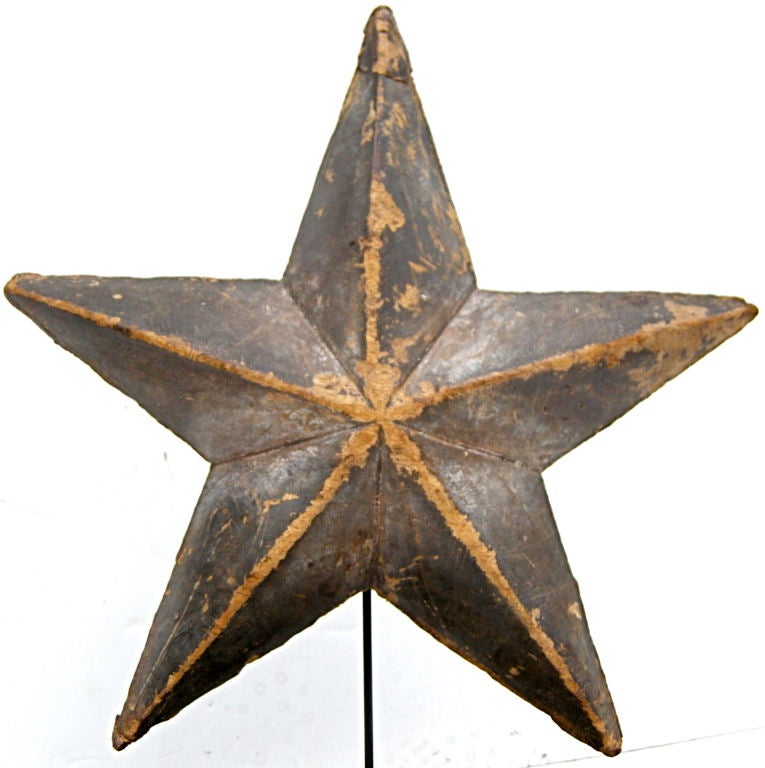 An elegant and folky, early hand made wooden star.  Having a naive and rustic appearance yet finely crafted and constructed resulting in an overall sculptural and beautiful design.  Soft time worn and weathered overall surface and patina.  Strong