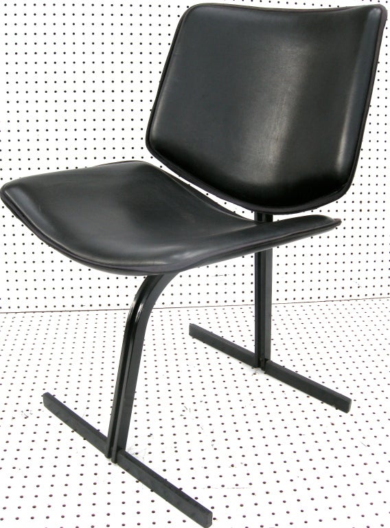 A great pair of architectually unique side chairs by renowned architect Mario Botta.   Having highly graphic shapes and forms with soft leather upholstery.  Comfort and style.