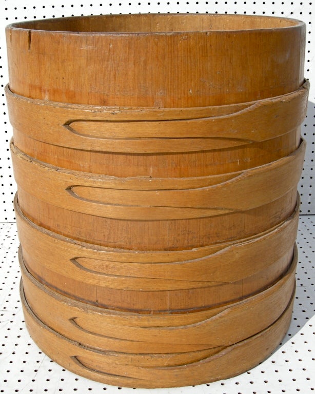 A simple but elegant vintage farm barrel.  Having beautiful hand crafted staves of interlocking shapes and forms delicately wrapping its exterior surface. Possible Shaker attribution. Ohio origins.