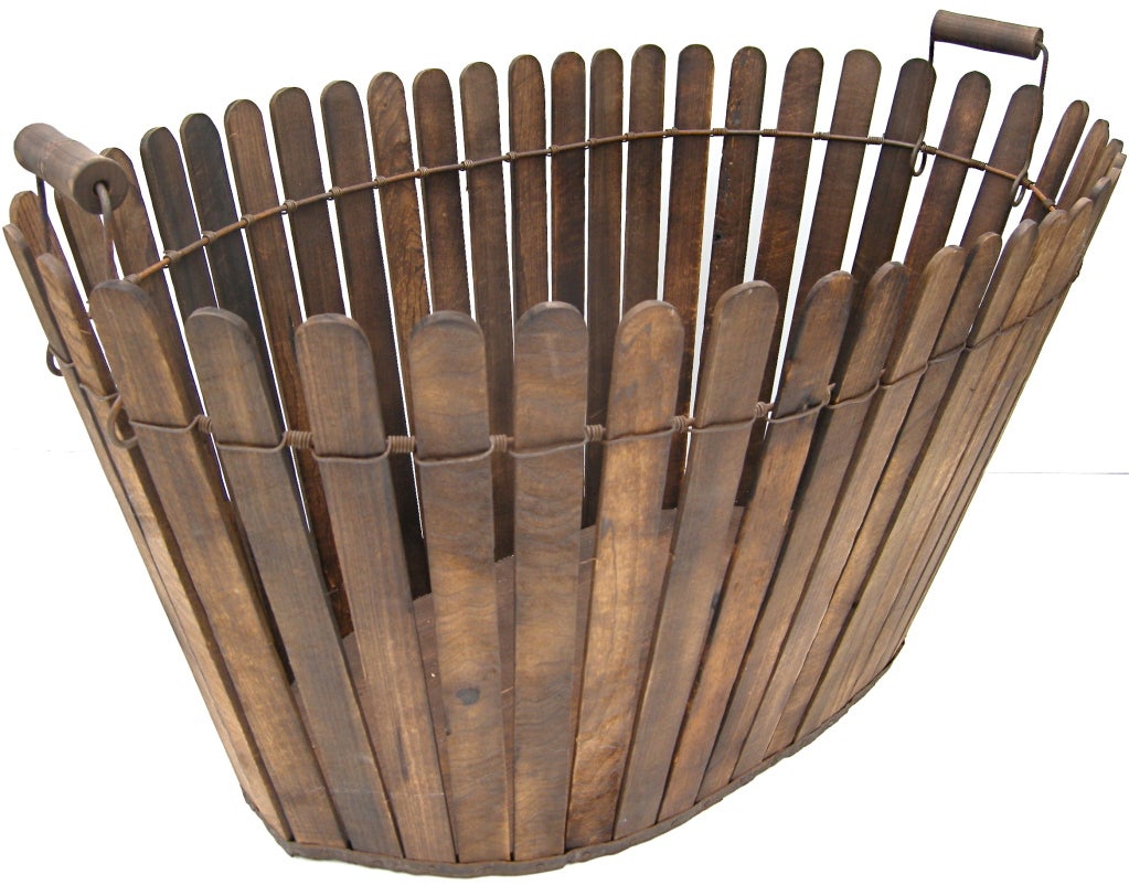 A terrific, uniquely designed, early splint basket. Originally thought to be Shaker made, a common consensus now is these were made near the Shaker settlement of Pleasant Hill, Kentucky. Recognized by the Shakers for their design, beauty and quality