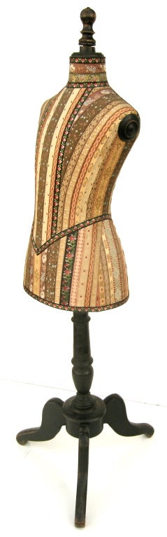 A truly resplendent and beautiful vintage, petite milliners mannequin.  Covered in spectacular and brilliant hand made silk ribbons of various patterns and shapes forming an aesthetic maze of vibrant colors and hues.  Probably used only for special