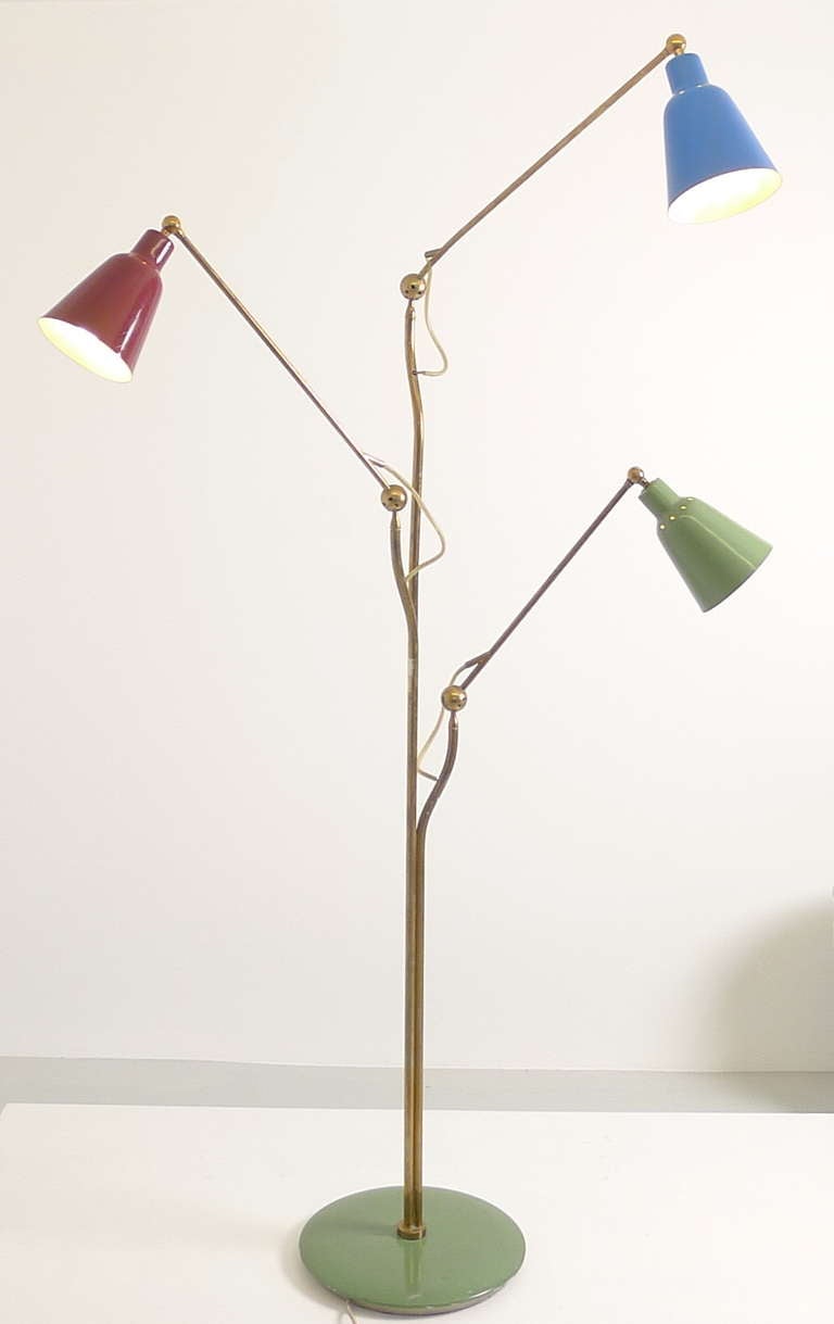 Angello Lelii for Arredoluce, Monza, Italy.  Early 1950's, stunning 3 arm floor lamp predating the Triennale.  Each arm can be adjusted through an ingenious  system of simply lifting the arm off and repositioning by choosing any one of a number of