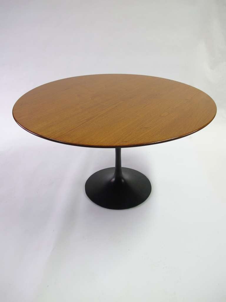 Eero Saarinen Tulip Dining Table by Knoll Associates.
The Walnut top is 48”.  The black enameled base is 28.5” tall.
This table is in original vintage condition.

I have other 48