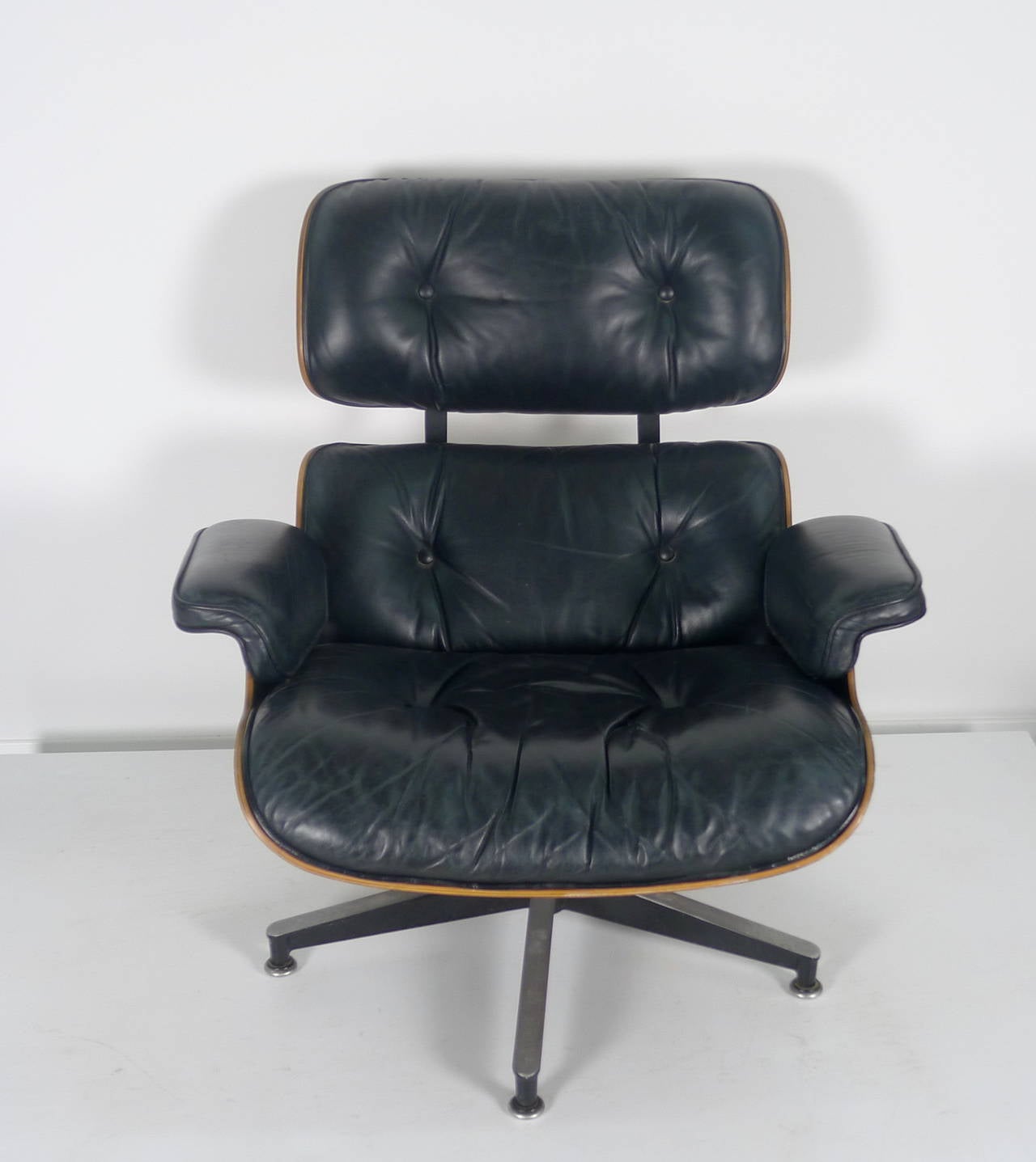 American Chair and Ottoman by Charles and Ray Eames, 670/671