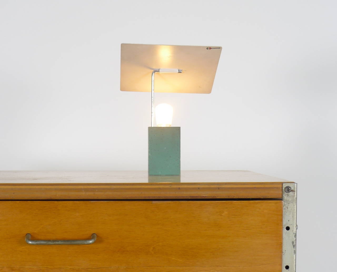 Gino Sarfatti for Arteluce, Italy, circa 1960s. Desk lamp with heavy cast base retaining it's original green paint, shade retained by a single chromed arm which swivels and coupled with the ability of the square metal shade to articulate means the