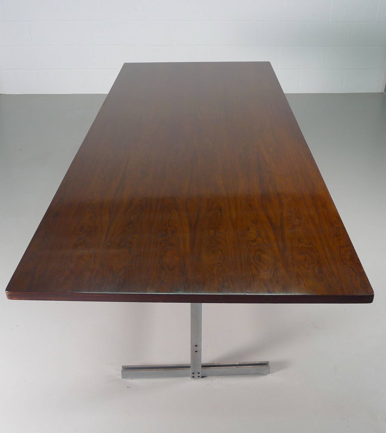 Jules Wabbes , Belgium . 1960's . Rosewood topped dining table or desk over stainless steel frame . Minimal and elegant .

Excellent vintage condition
