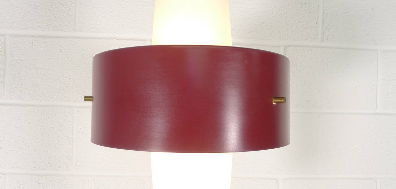 Stilnovo floor lamp , marble base incorporating foot switch , brass upright supporting glass shades and metal outer ring enamelled in original burgundy colour . Early red circular Stilnovo label to inside which has  6 bulbholders .

Excellent
